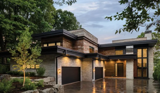 A newly built modern home with clean lines and a wide driveway